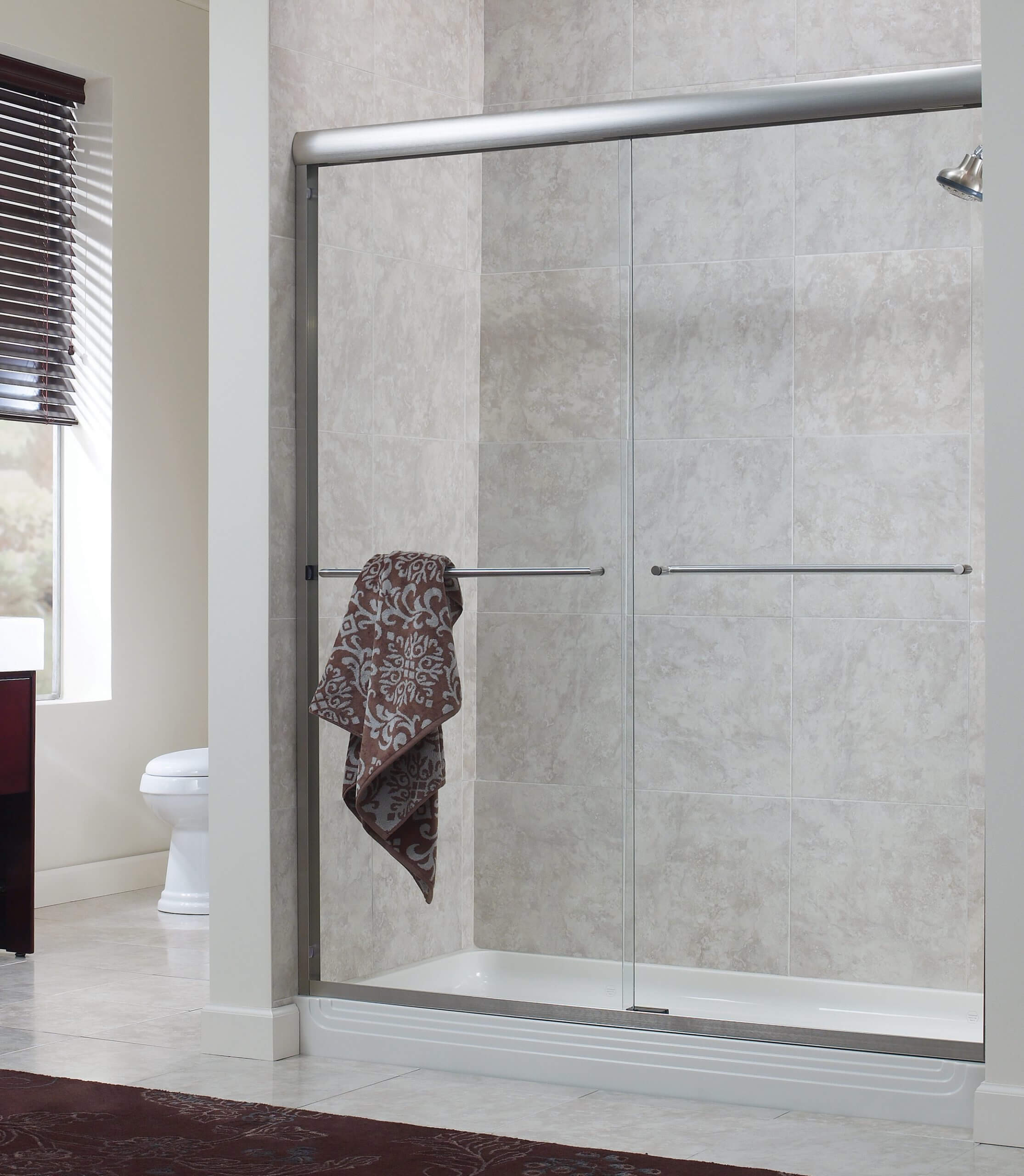 Frameless sliding glass clearance shower doors
