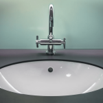 bathroom countertop surface and round sink