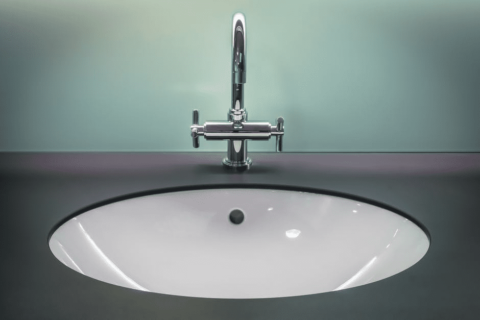 bathroom countertop surface and round sink