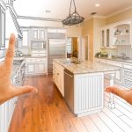 Female Hands Framing Gradated Custom Kitchen Design Drawing and Photo Combination.